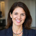 Professional woman, Priya K., HR Manager, mid-40s, looking positive in a business setting